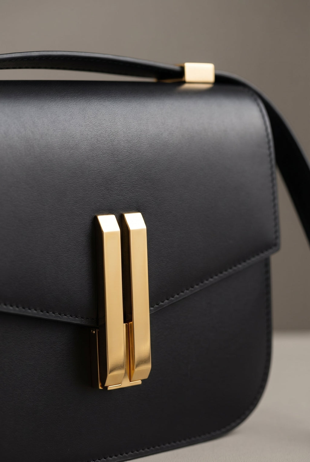 Obsidian Form | Structured Black Leather Shoulder Bag with Gold Clasp 1